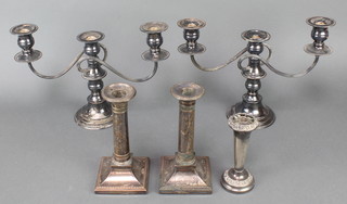 A pair of plated candlesticks with plain stems and square bases 7 1/2" and a pair of 3 light candelabra 
