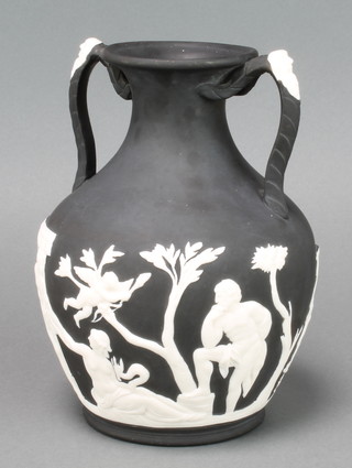 Portland Vase a black basalt 2 colour baluster vase with twin handles decorated with bearded masks, the body decorated with a band of semi-clad classical figures, the base with portrait bust  beneath a tree, 9"