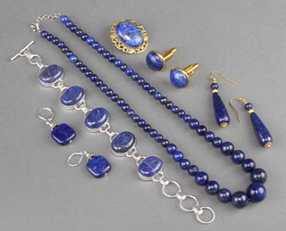 A lapis lazuli necklace, bracelet, brooch, 2 pairs of earrings and a pair of cufflinks