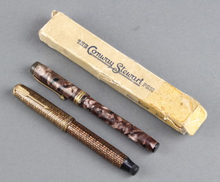 A Conway Stewart brown marbled fountain pen with 14ct nib boxed and a Parker Gold Block pattern duofold fountain pen with 14ct gold nib 