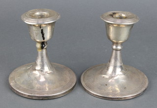 A pair of silver dwarf candlesticks of plain form Birmingham 1914 4" 