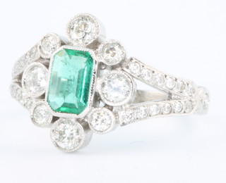 An 18ct white gold emerald and diamond Victorian style ring size N 