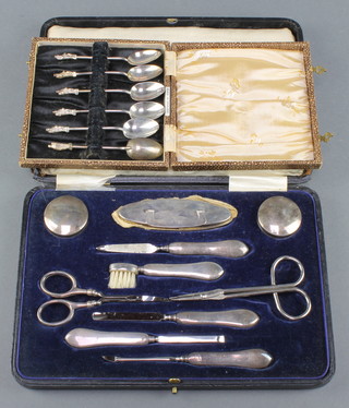 A silver 9 piece manicure set Birmingham 1923 and 6 small apostle spoons