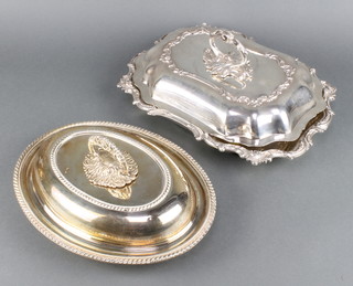 An oval silver plated entree dish and cover and 1 other 
