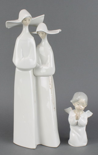 A Lladro figure of 2 nuns 13", do. of a kneeling angel 5" 
