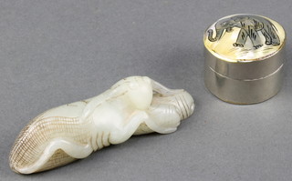 An Oriental carved green hardstone figure of a cricket 3" and a cylindrical white metal jar and cover the lid decorated elephants