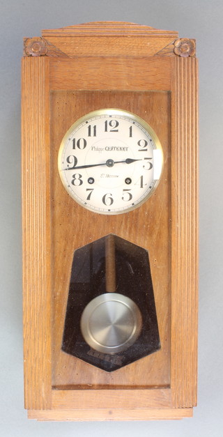A French Art Deco 8 day striking wall clock with 6 1/2" silvered dial and Arabic numerals, the dial marked Philippe Chatenet St Hermin  contained in an oak case 