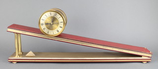 Dent of London, a limited edition incline plane gravity clock, the gilt metal barrel case with  silvered dial and Roman numerals on a leather mounted platform, no. 428 of 500 complete with certificate