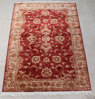 A gold and floral patterned Ziegler rug 90" x 64" 