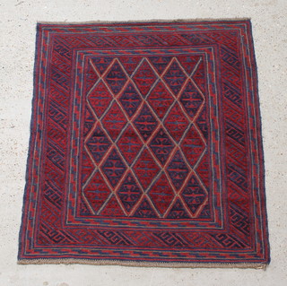 A red, blue and white ground Tribal Gazak rug with multiple diamonds to the centre 48" x 43" 

