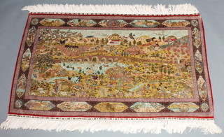 A fine silk rug decorated a landscape depicting a lake with a bridge, volcano in the distance and animals 30 1/2" x 49" 
