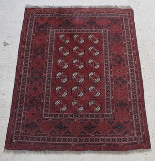 A red and blue ground Afghan rug with 18 octagons to the centre, some wear, 66" x 52" 