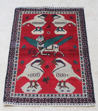 A red ground tribal pictorial rug decorated mythical beast and birds 57" x 35" 