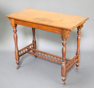 A Victorian rectangular walnut centre table raised on turned supports with H framed stretcher and bobbin turned decoration 29"h x 46"w x 18"d 
