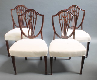 A set of 4 19th Century Hepplewhite style mahogany shield back dining chairs with pierced vase shaped slat backs and over stuffed seats, raised on square tapering supports, spade feet 