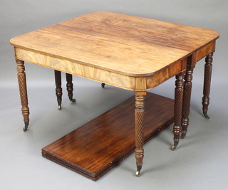 A George III mahogany extending dining table, raised on 8 spiral turned legs, complete with 3 extra leaves 27"h x 100"l x 43"w 