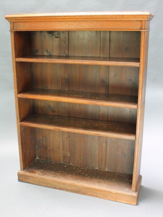 A Victorian oak open bookcase fitted adjustable shelves raised on a platform base, 48" x 36"w x 11"d 