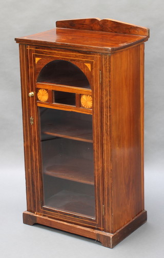 A Victorian inlaid rosewood music cabinet with raised back, fitted shelves enclosed by  a glazed panelled door 37 1/2"h x 21"w x 14"d 