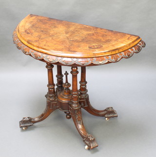 A Victorian carved and figured walnut card table, raised on 4 turned supports with splayed feet 28"h x 37"w x 19 1/2"d 