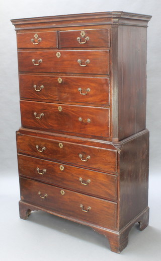 A George III mahogany chest on chest, the upper section with moulded cornice and fluted canted corners, fitted 2 short and 3 long drawers, the base fitted 3 long drawers 73"h x 44"w x 22"d 