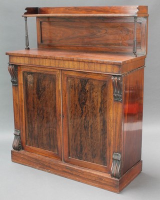 A Victorian simulated rosewood chiffonier with raised shelf back, the base enclosed by a panelled door 49"h x 40"w x 16"d 