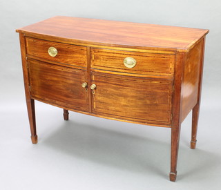 A 19th Century crossbanded mahogany bow front sideboard fitted 2 drawers above a double cupboard enclosed by panelled doors raised on square tapering supports spade feet 35 1/2"h x 48"w x 23"d 
