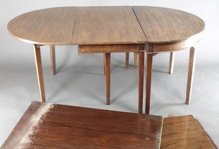 A Georgian oval drop flap D end dining table with 3 extra leaves, raised on 10 tapered supports 28"h x 44"w, the D sections each 17 1/2" and when fully extended with the 3 extra leaves 142"l 