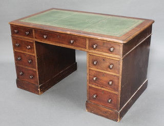 A mahogany desk with inset leather writing surface above 1 long and 8 short drawers 27 1/2"h x 47 1/2"w x 27 1/2"d 