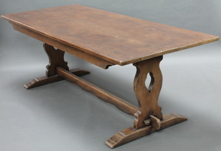 An 18th Century style oak refectory dining table, the top formed of 5 planks, raised on standard end supports with H framed stretcher  30"h x 36"w x 84"l 