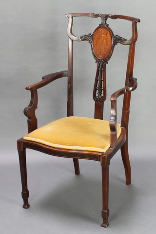 An Edwardian inlaid mahogany open arm chair the seat of serpentine outline, raised on cabriole supports 