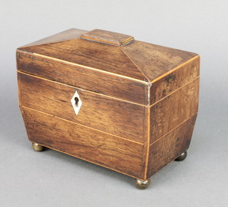 A 19th Century inlaid rosewood tea caddy of sarcophagus form with satinwood stringing and ivory escutcheon, raised on bun feet 5 1/2" x 7" x 4" 