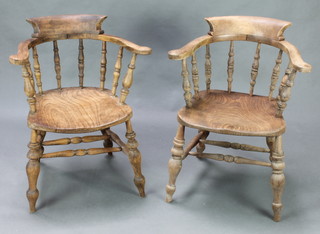 A pair of bleached elm smokers bow chairs with H framed stretcher raised on turned supports