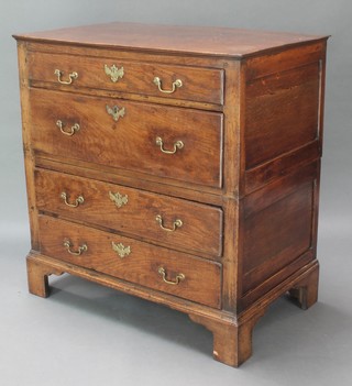 A Georgian oak chest of 3 long drawers with brass swan neck drop handles, raised on bracket feet 39"h x 36 1/2" x 22"