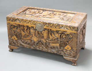 A carved camphor coffer decorated ships, raised on bracket feet 22"h x 39"w x 20"d 