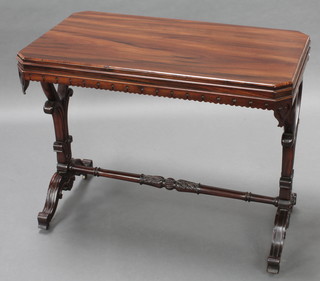 A Victorian rectangular rosewood table with carved apron, raised carved supports with turned H framed stretcher 28"h x 36"w x 20 1/2"d 

