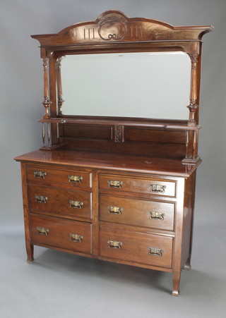 An Art Nouveau mahogany chiffonier sideboard with arched plate mirrored back fitted a shelf, the base fitted 6 short drawers 79"h x 54"w x 19"d 