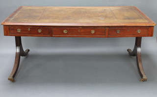 A 19th Century mahogany library table with inset writing surface fitted 6 long drawers raised on turned supports 31"h x 70"w x 44 1/2"d