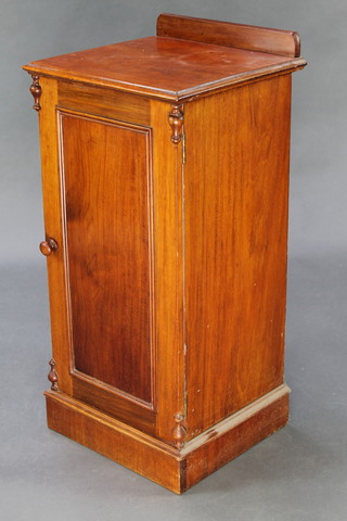 A Victorian mahogany pot cupboard with raised back and panelled door, on a platform base 33"h x 15 1/2"w x 14 1/2"d 