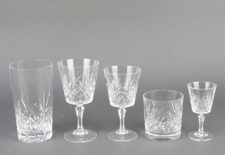 A quantity of table glassware comprising 9 tumblers, 9 high balls, 18 wine glasses, 15 sherries and 7 liqueurs 