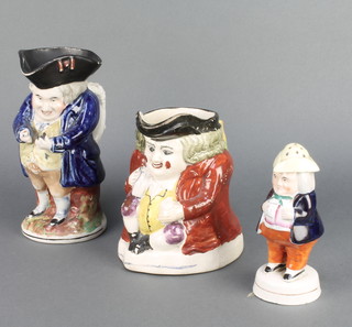 A 19th Century Staffordshire Toby jug of a snuff taker 8", do. gentleman 7" and a stuck pepperette