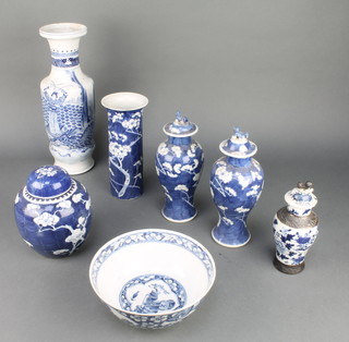 A Chinese waisted blue and white vase decorated with figures fighting a dragon 12", a pair of oviform prunus vases and covers 8", do. ginger jar, spill vase and bowl together with an oviform crackle glazed vase 4" 