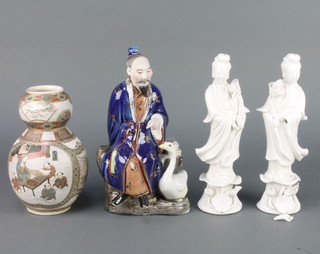 A 20th Century Chinese figure of a seated gentleman with goose 8", 2 blanc de chine figures of Guan Yin 8", a Satsuma gourd shaped vase decorated with figures at pursuits 6" and a famille rose saucer