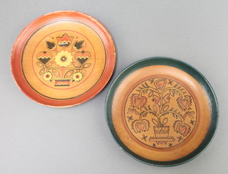 A pair of turned wooden and painted dishes, the reverse marked Festival Budapest 1949 6"diam.  