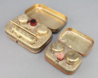 A Victorian gilt metal cased travelling 2 bottle inkwell complete with 2 bottles, candle, propelling pencil 1 1/2"h x 4 1/2" x 3" together with a smaller ditto (no pencil) 1 1/2" x 3 1/2" x 2" 