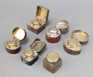 Six 19th Century brass and leather travelling inkwells
