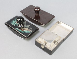 A polished steel and leather covered travelling inkwell with hinged lid 2" x 2 1/2" x 2 1/2" and a Marquis brown Bakelite blotter and a black lacquered blotter 