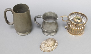W Avery & Sons, a Victorian oval brass pin cushion in the form of a hedgehog 1" x 2 1/2" x 2 1/2", a pierced brass chamberstick, a George V half pint baluster tankard and a pewter tankard 
