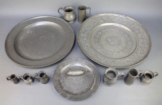 A pewter charger with London touch mark, the reverse marked RC 16", an engraved pewter charger 17", a circular pewter plate with London touch mark 9", 4 Victorian pewter measures - half pint, gill, half gill and 1/4 gill and 4 Continental pewter measures  