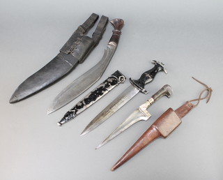 A Kukri with 12 1/2" blade and leather scabbard and 2 skinning knives together with an Indian "Kard" style dagger with 6 1/2" blade, horn handle, leather scabbard and a reproduction German dagger with 8 1/2" blade 