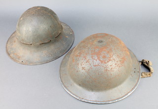 A Second World War steel helmet dated 1940 together with a Fire Watchers helmet complete with liner 